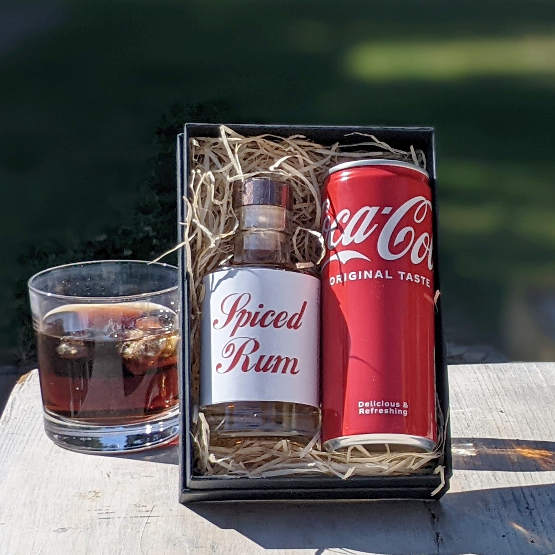 A Clear Glass with Rum and Coke Inside · Creative Fabrica
